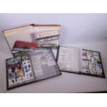 Two stamp albums containing stamps from the late C20th and early C21st, together with an album of