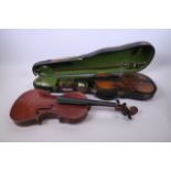 Two student violins, one cased with a bow, one 22", the other 23½"