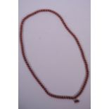 A string of orange banded agate beads, 33" long