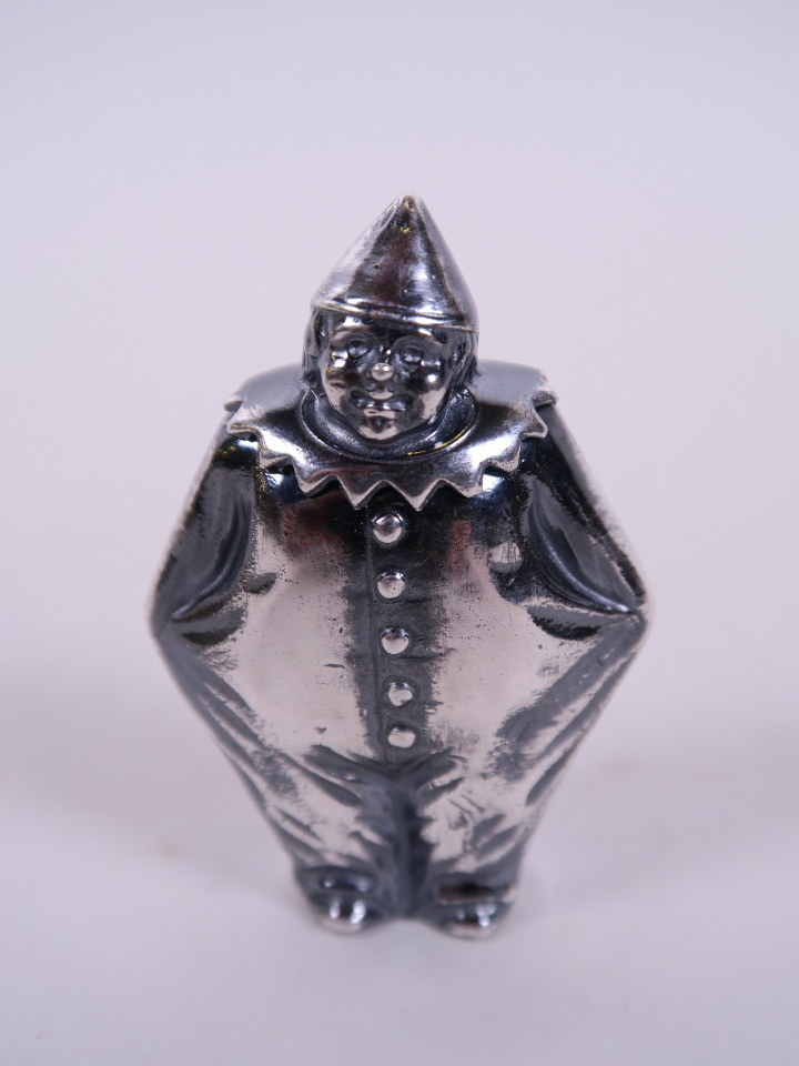 A silver plated vesta case in the form of a rotund clown, 1½" wide