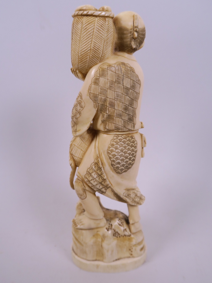 A Japanese marine ivory carving of a farmer with two baskets of vegetables, 7½" - Image 2 of 2