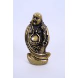 A Chinese bronze of a jolly Buddha, 5½" high