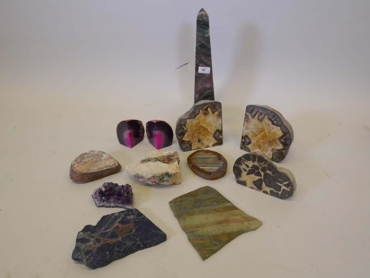 A collection of geological specimens, including lapis, quartz, amethyst and a pair in the form of