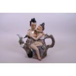 A Chinese polychrome porcelain erotic teapot, 8½" wide