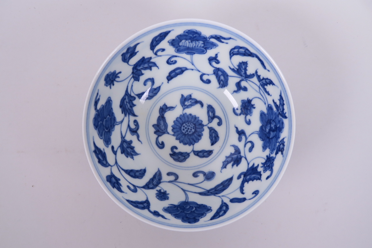 A Chinese blue and white porcelain rice bowl with scrolling floral decoration, 6 character mark to - Image 2 of 4
