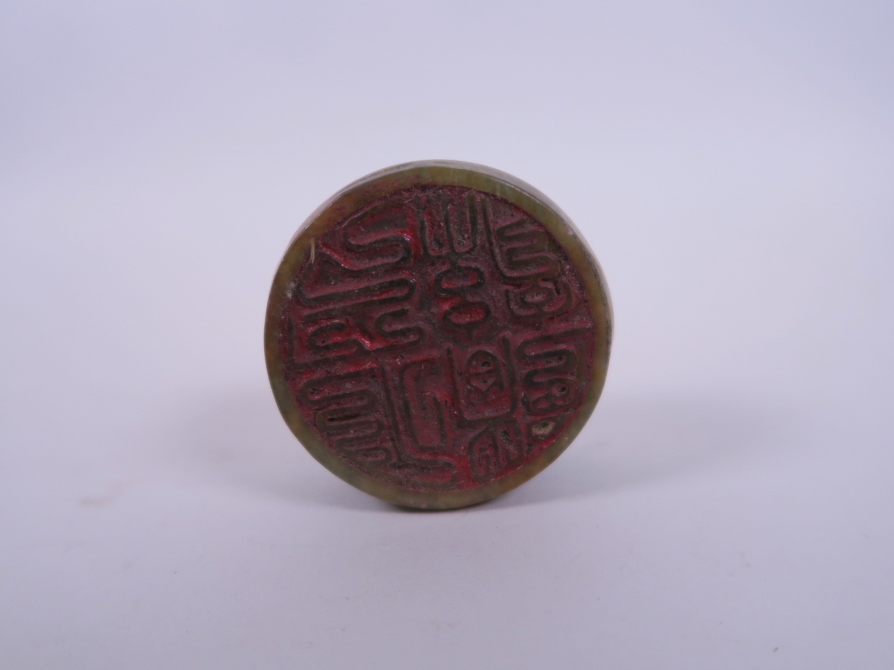 A Chinese mottled hardstone cylinder seal with carved decoration to the top of Chan Chu, 2" diameter - Image 2 of 2