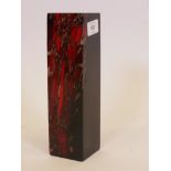 A Murano black glass pillar vase with red swirled and aventurine decoration, 9½" high