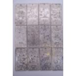 A set of twelve Chinese white metal zodiac tablets with chased and engraved decoration of the zodiac