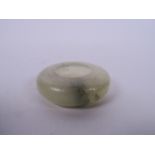 A Chinese carved jade water holder, 2" diameter