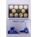 A cased collection of facsimile (replica) Chinese coins commemorating important monuments of