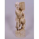 A Japanese marine ivory carving of a farmer with two baskets of vegetables, 7½"