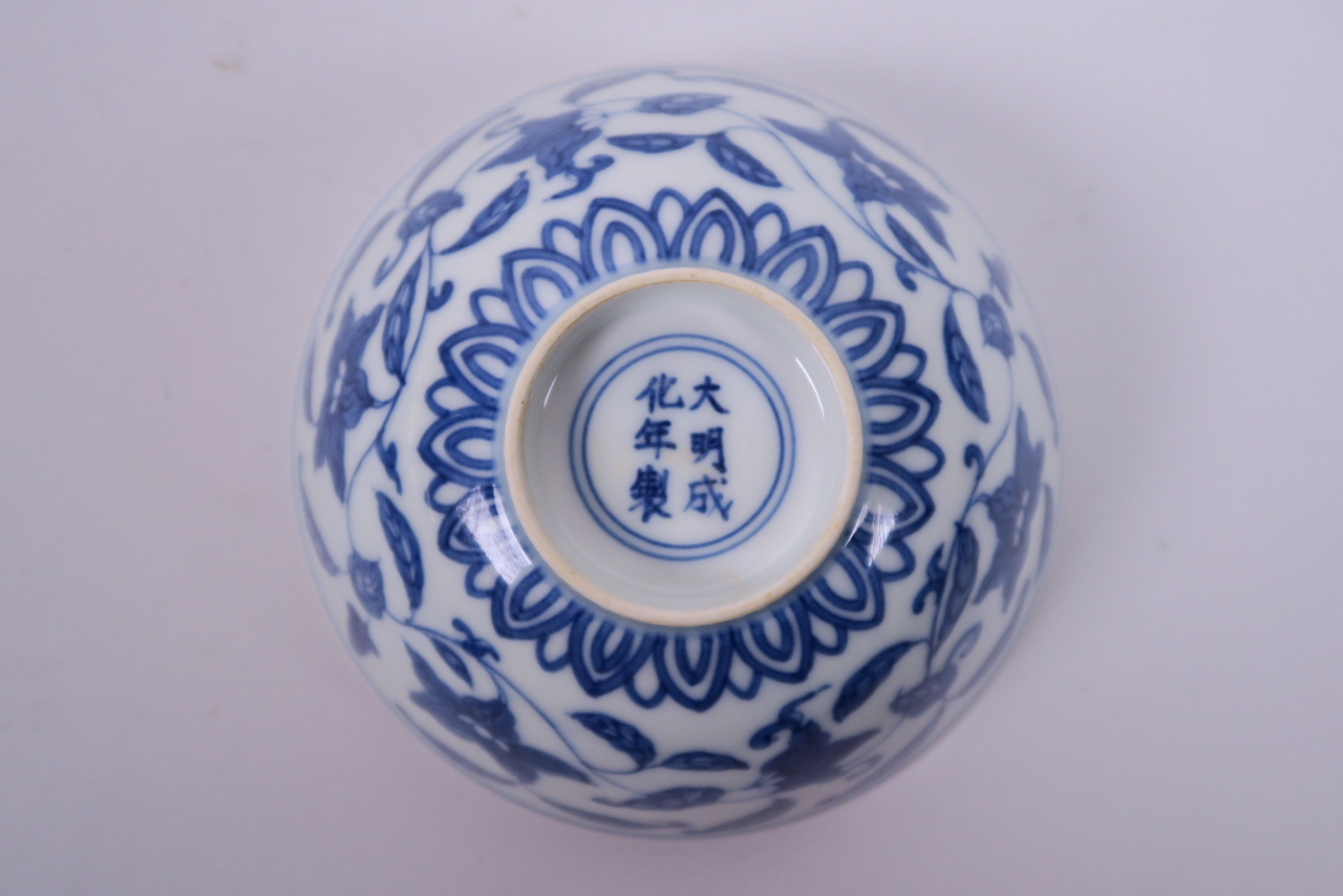 A Chinese blue and white porcelain rice bowl with scrolling floral decoration, 6 character mark to - Image 3 of 4