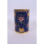 A Chinese cloisonné brush pot with lotus flower decoration, 5" high, 3½" diameter