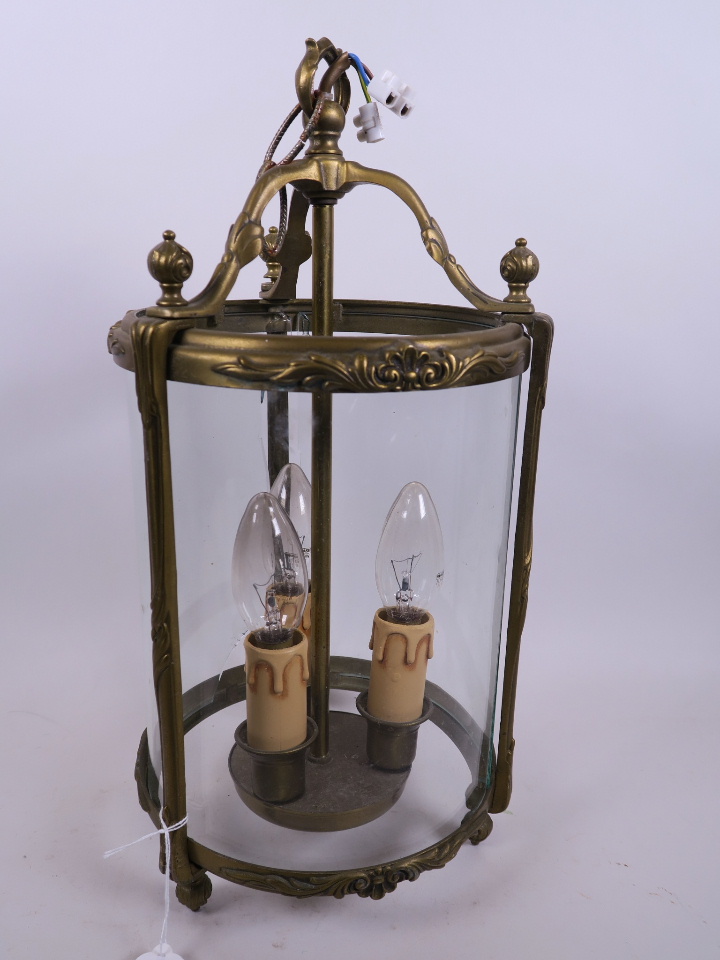 An Empire style cylindrical porch lantern with brass frame and glass panels, A/F, 15" high, 8"