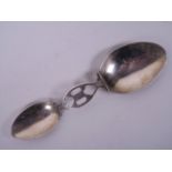 A folding silver two part doctor's spoon, 2½" long folded