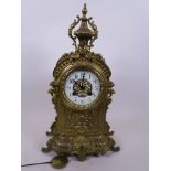 A C19th French ormulu cased mantle clock with enamelled dial and Arabic numerals, 15" high