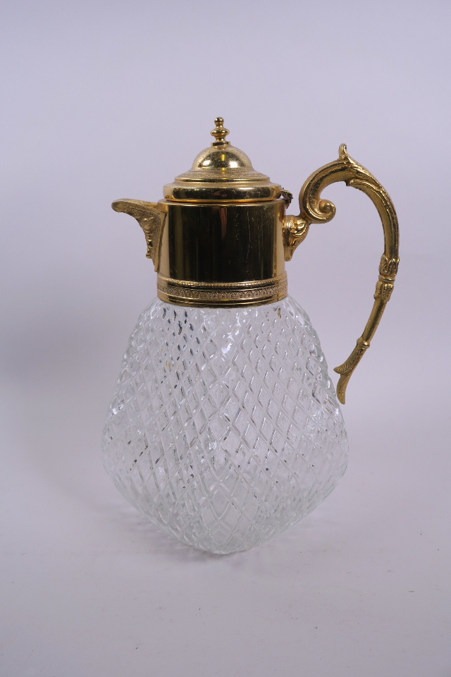 A Harrod's gilt mounted glass claret jug, A/F repair to hinge, 10½" high