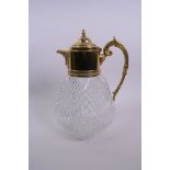 A Harrod's gilt mounted glass claret jug, A/F repair to hinge, 10½" high
