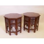 A pair of brass inlaid mahogany Islamic style occasional tables of octagonal form, 21½" x 21½",