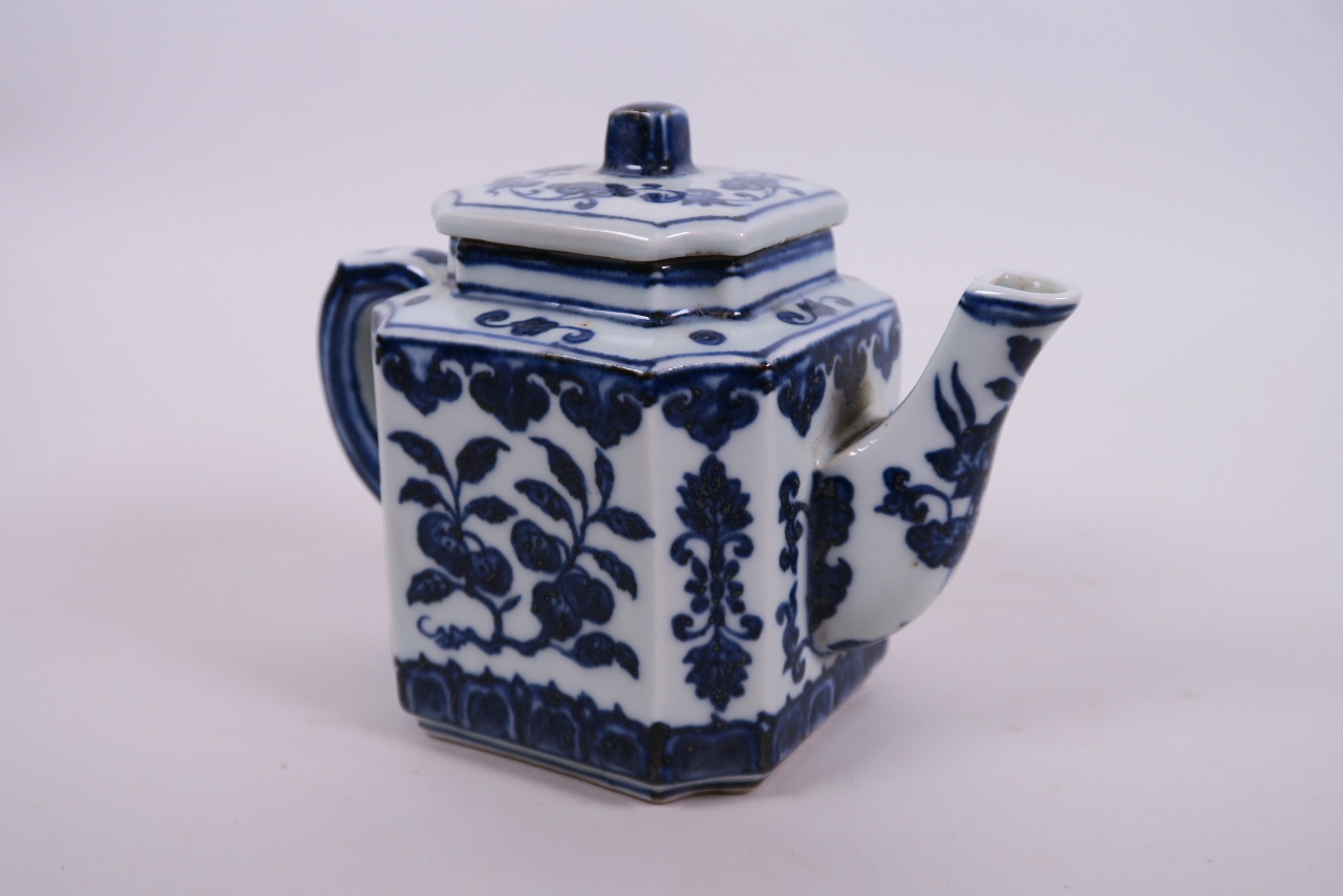 A Chinese blue and white porcelain teapot of square form decorated with fruiting branches, 4