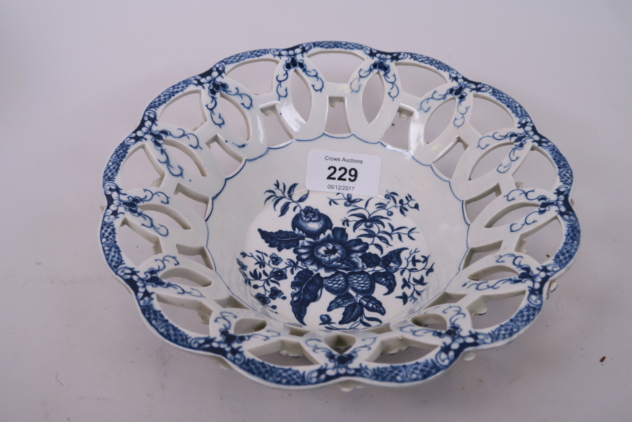 A C18th Worcester blue and white basket, with pierced sides and pinecone decoration, 8" diameter