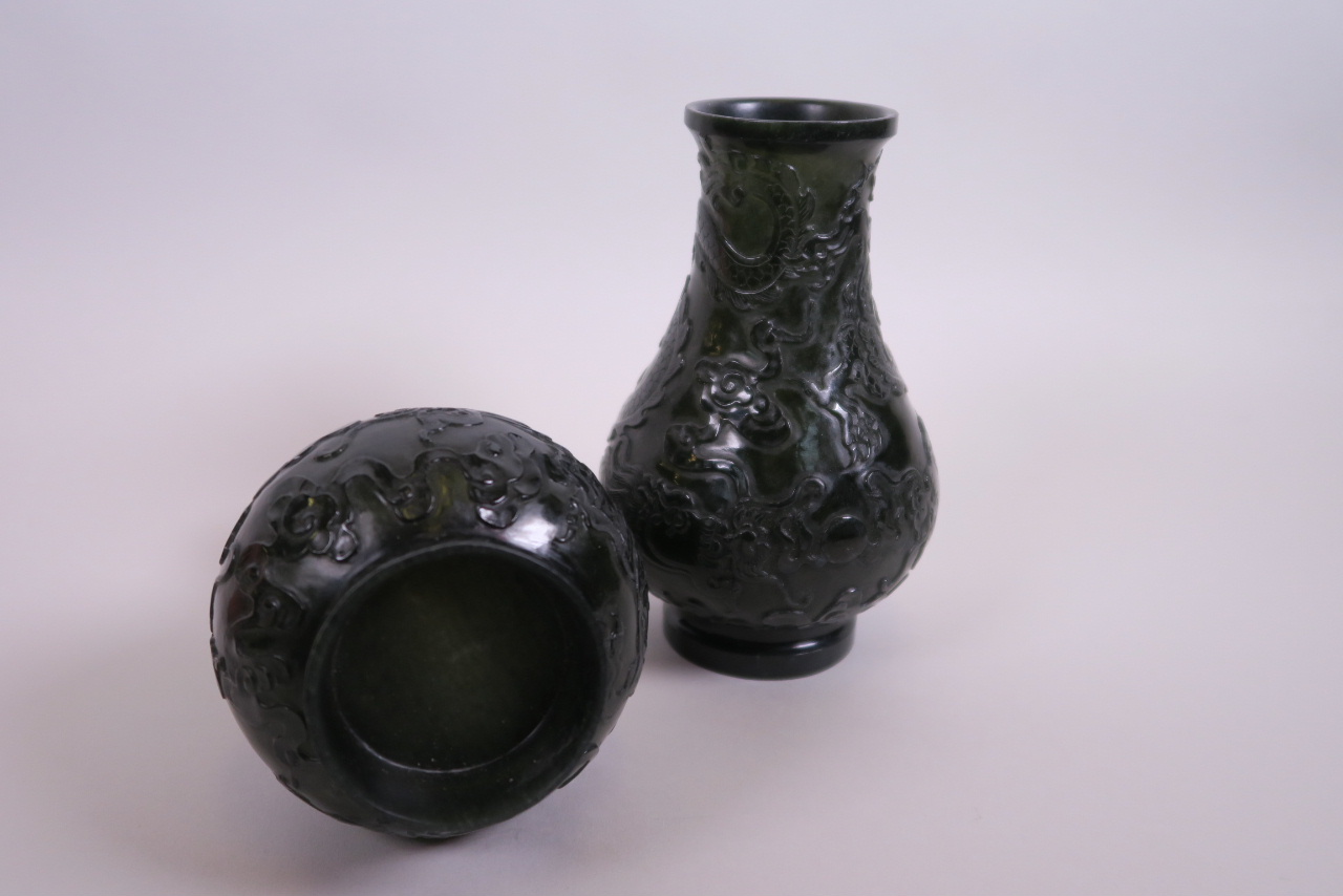 A pair of Chinese spinach jade vases with carved decoration of dragons chasing the flaming pearl, 6" - Image 3 of 3