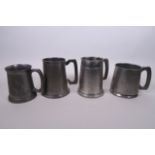 A collection of four pewter tankards, one with engraved Chinese dragon decoration, largest 5"