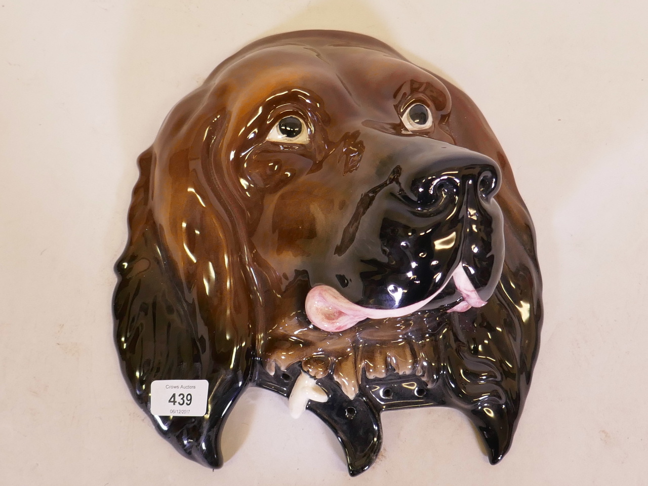 A Beswick wall plaque in the form of a dog's head, no. 668, 11" high