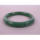 A marbled green glass bangle, 3" diameter