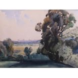 Fred Camp, watercolour of trees in a landscape with distant buildings, signed and dated 1935