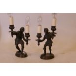 A pair of C19th/C20th bronze lamps in the form of hunters, 9" high