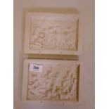 A pair of reconstituted marble plaques depicting putti, 5" x 7"