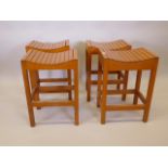 A matched set of four stained beech stools