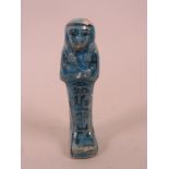 An Egyptian terracotta faience shabti with turquoise glaze, 4½" long