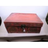 A Chinese leather travel trunk with embossed symbols and brass fittings, 26" x 17½" x 12"