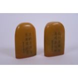 A pair of Chinese amber soapstone seals with character inscription decoration, 2½" high