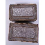 A pair of antique Indo-Persian cigarette boxes with silver plated panels embossed with many