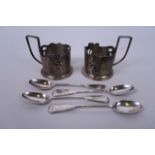 A pair of Russian silver plated tea glass holders with engraved floral decoration, and a set of four