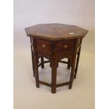 An Indian Hoshiarpur hardwood octagonal occasional table with bone inlaid decoration, A/F losses,