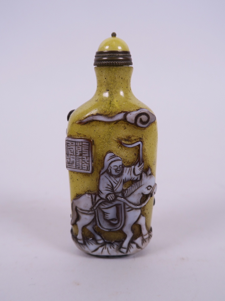 A Peking glass snuff bottle, with decoration of travelling figures, 3½" high - Image 2 of 2