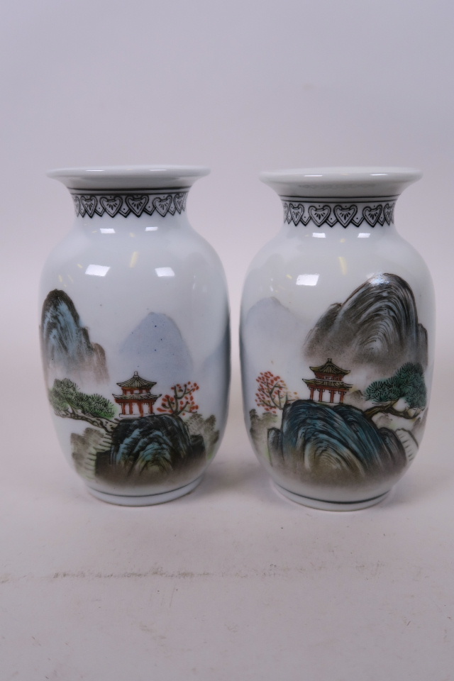 A pair of Chinese Republic porcelain vases with enamelled mountain landscape decoration, seal mark