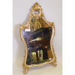 A Venetian painted and cartouche shaped parcel gilt pier glass, 44" x 25"