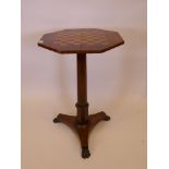 A C19th rosewood occasional table with an inlaid chessboard top, raised on an octagonal pedestal