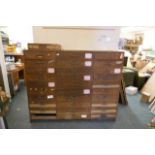 A large flight of pine workshop drawers, 65" x 26", 53" high