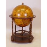 A 1970s cellarette in the form of a terrestrial globe, 24" x 34" high