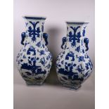 A pair of tall Chinese porcelain hexagonal section vases of bulbous form with elephant head