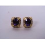 A pair of 14ct yellow gold, amethyst and diamond set earrings