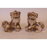 A pair of ceramic figures of kylin, with pearls in their mouths, 6" high