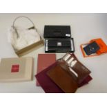 A Piquadro Nikolai leather wallet, in original case, a Cole and Haan cream fur clutch bag, a