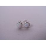 A pair of silver and opalite set stud earrings